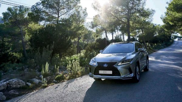 Lexus ES 300h driving in a rural area 