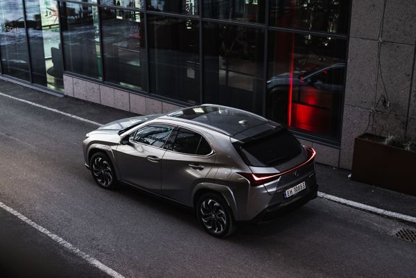 A Lexus driving past an office