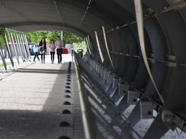 Toyota UK head office, employees walking through the entrance