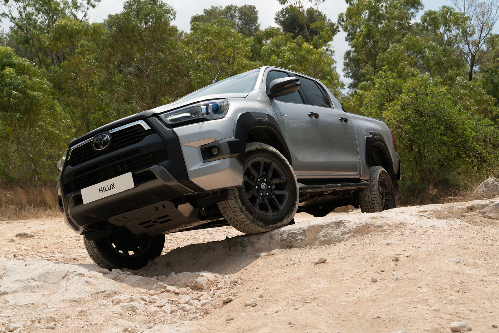 Hilux on the road towing an all-terrain caravan