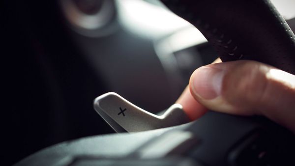 Lexus IS hand on a steering wheel