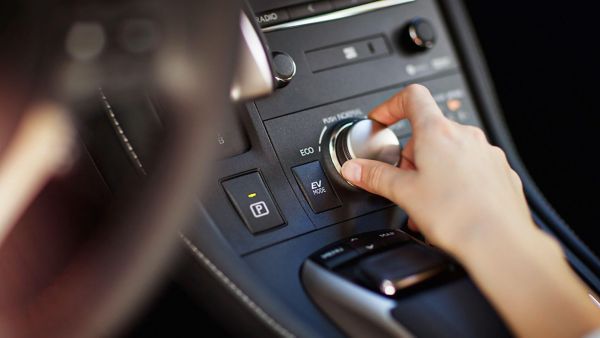 person moving a dial inside a Lexus CT 200h