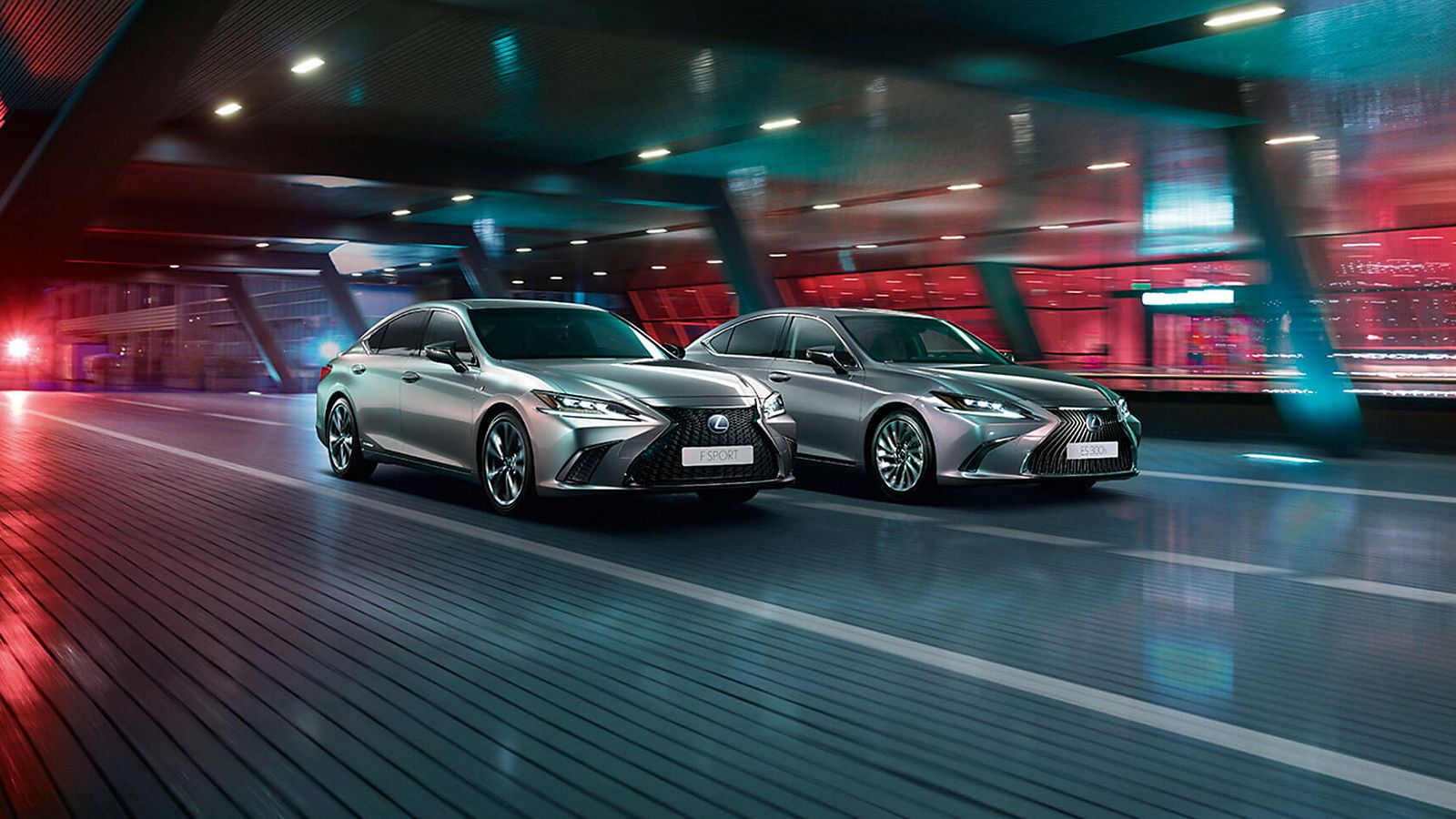 A Lexus ES F Sport and Lexus ES 300h driving through an underpass 