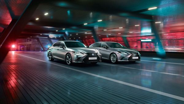 A Lexus ES F Sport and Lexus ES 300h driving through an underpass 