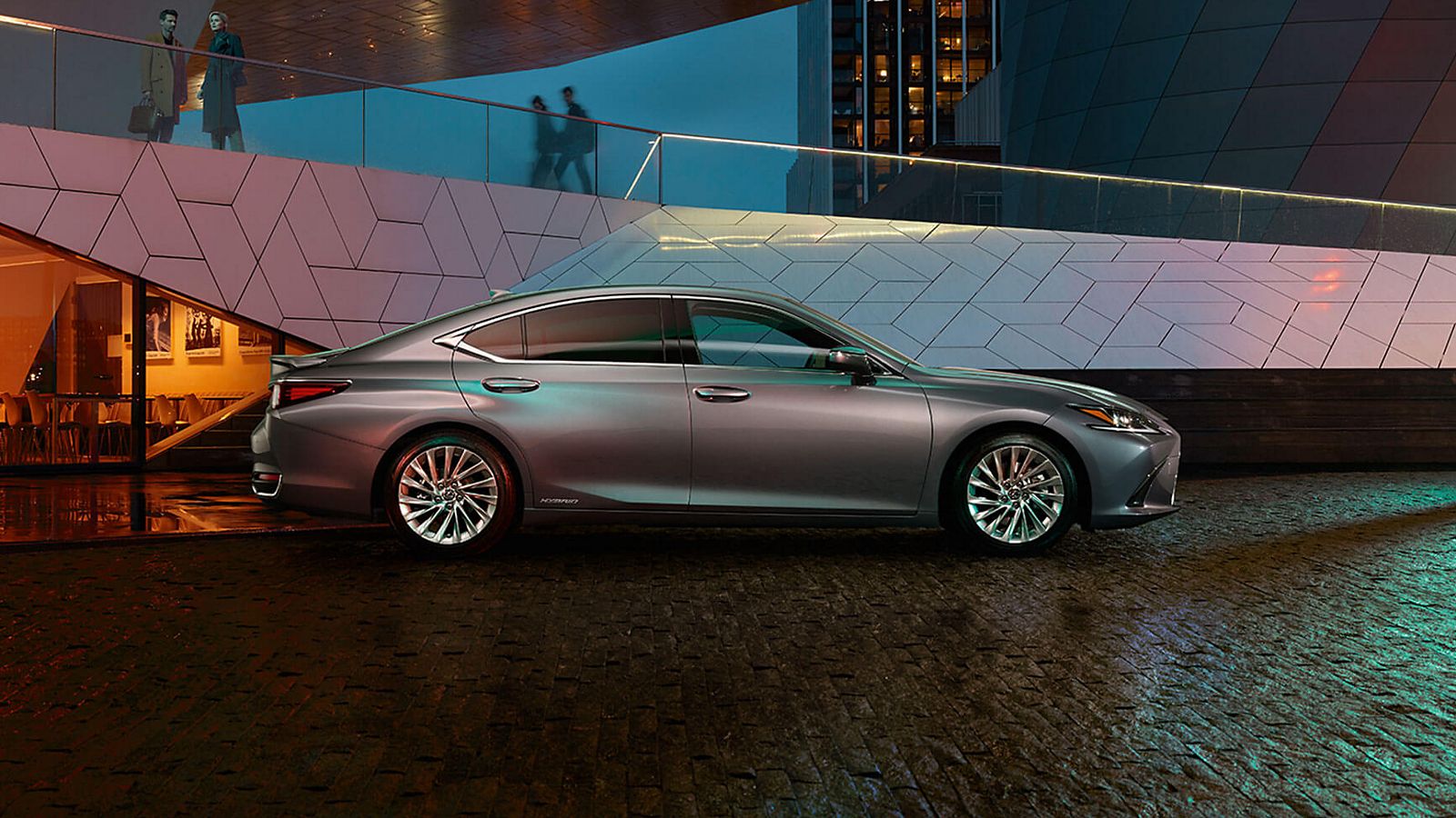 Lexus ES 300h parked in front of a building 
