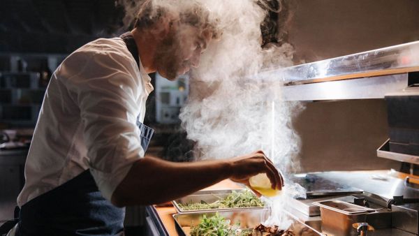 Sergio Barroso cooking with steam rising up