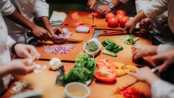 collection of people cutting vegetables