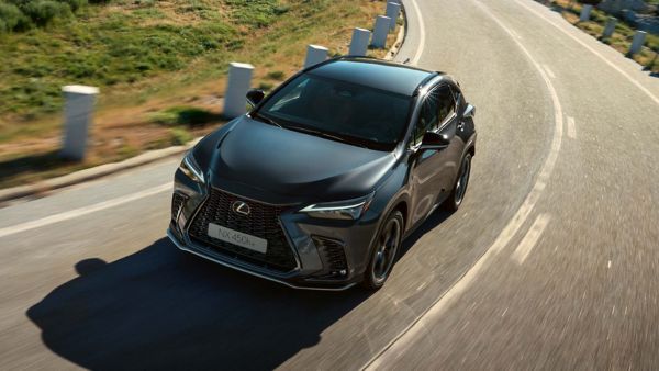 A Lexus UX 300e and Lexus NX plugged into a charging tower 