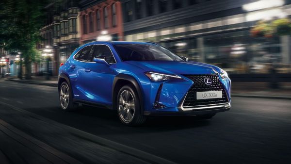 Lexus UX EV driving on a city road