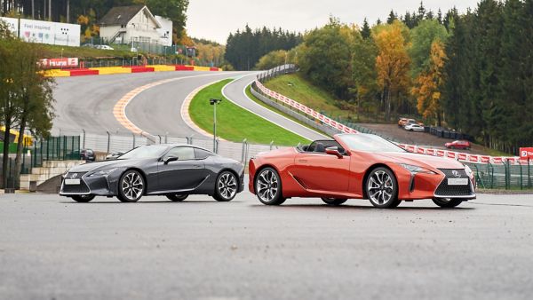 Lexus LC and LC Convertible parked in front of a racetrack 