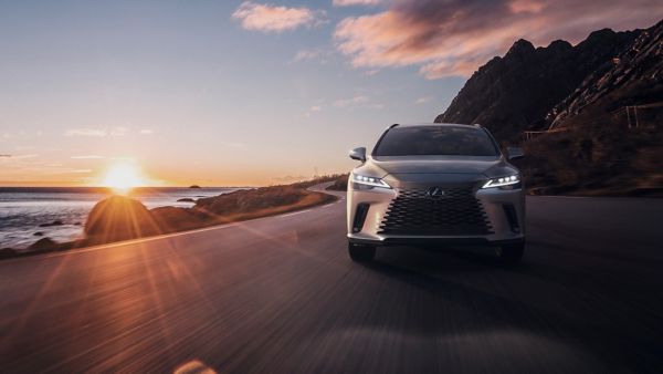 A Lexus driving on a coastal road