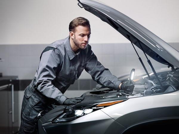 A Lexus mechanic working on a Lexus