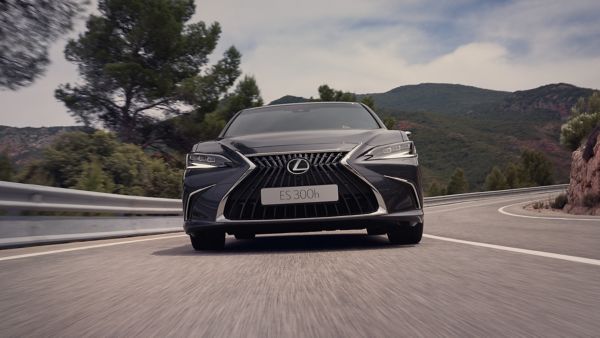 A Lexus ES driving on a road