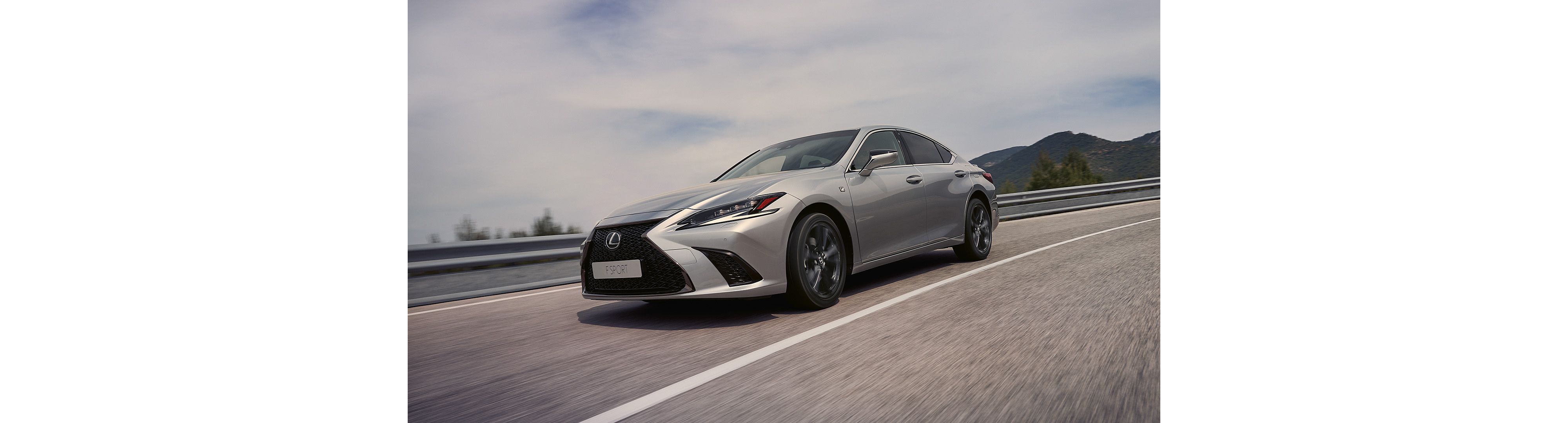 Side view of the Lexus ES driving on a road