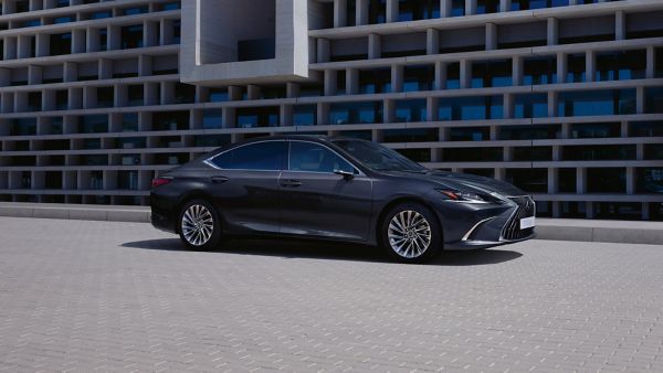 Side view of a Lexus ES parked outside a building 