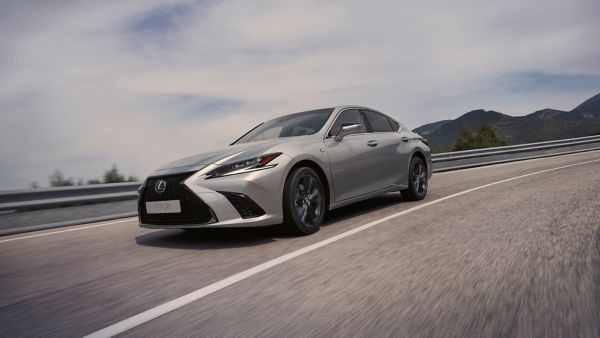 A Lexus ES driving on a road