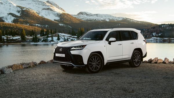 A Lexus LX parked in front of a lake