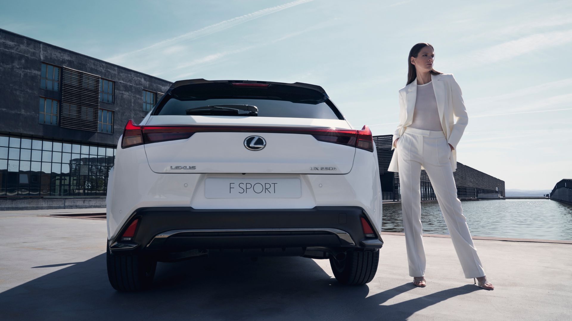 A person stood next to a Lexus UX F Sport