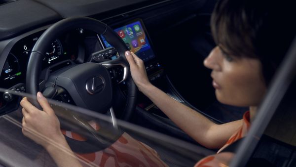 A woman sat in a Lexus cockpit