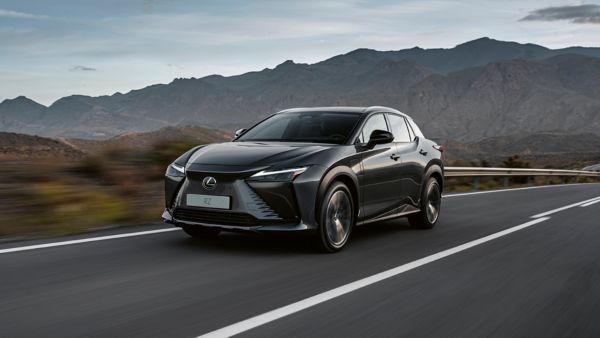 Lexus RZ driving in a rural location