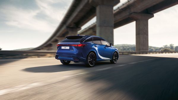 A Lexus RX 500h driving on a road
