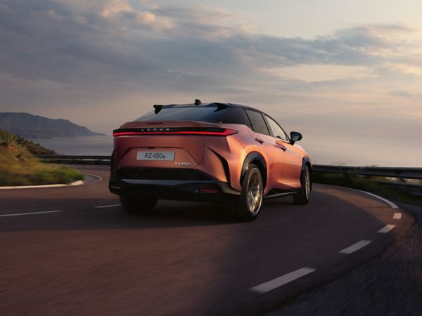 Lexus RZ driving on a coastal road