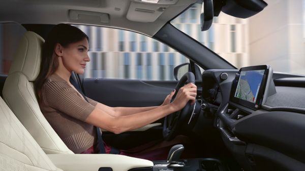 A person driving a Lexus