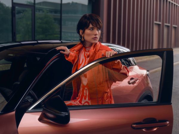 A person getting into a Lexus