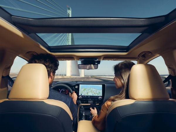 Two people sat inside a Lexus