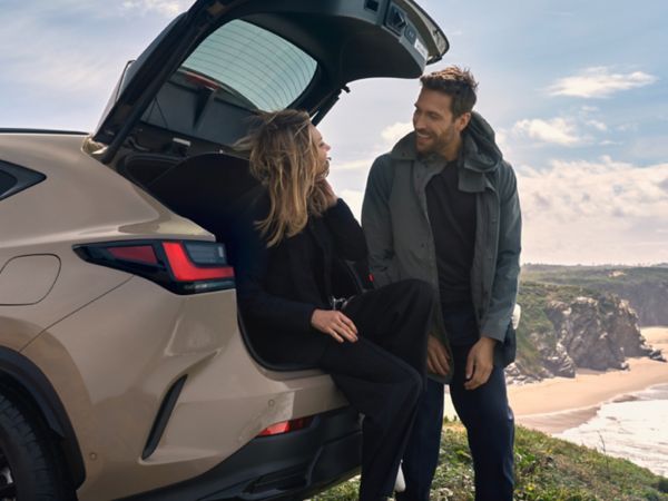 A person sat in the boot of a Lexus