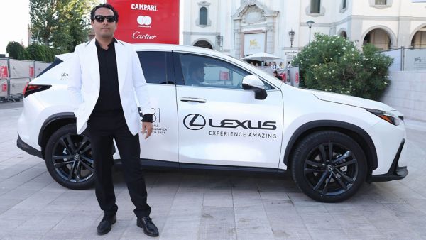 A person stood by a Lexus at the 81st Venice film festival