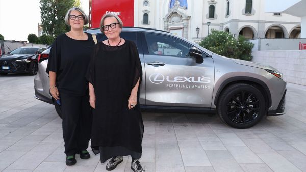 Katarzyna Adamik and Agnieszka Holland stood by a Lexus at the 81st Venice film festival