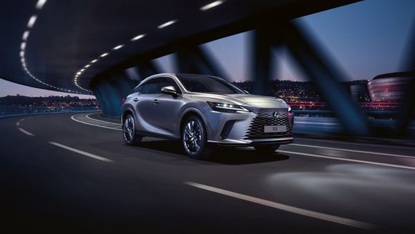 A Lexus RX driving on an overpass