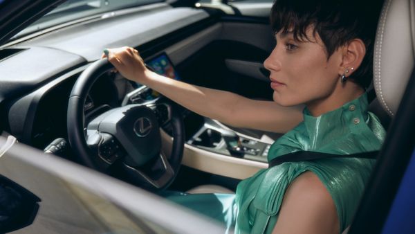 Woman driving Lexus vehicle