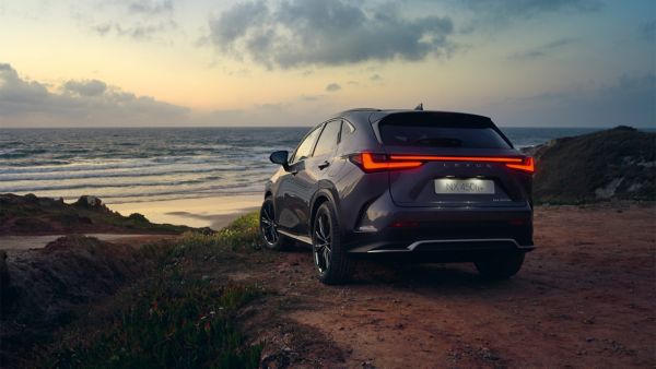 Lexus NX 350h driving across a bridge