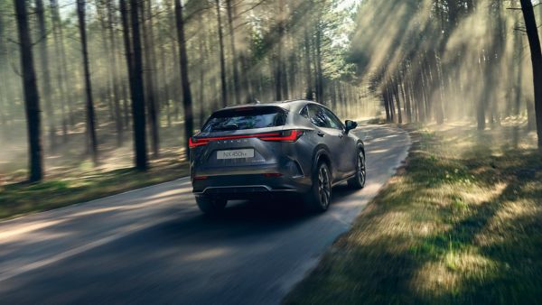 Lexus NX 450h+ driving on a road