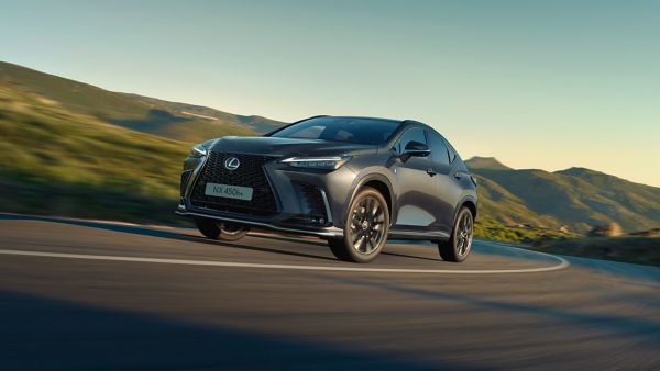 Lexus NX 450h+ driving on a rural road