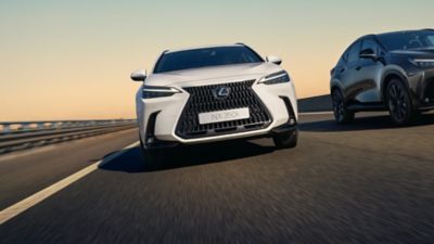 Lexus LX driving around a corner in a city location 
