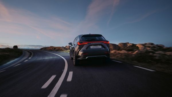 Rear of view of a Lexus NX 450h+ driving