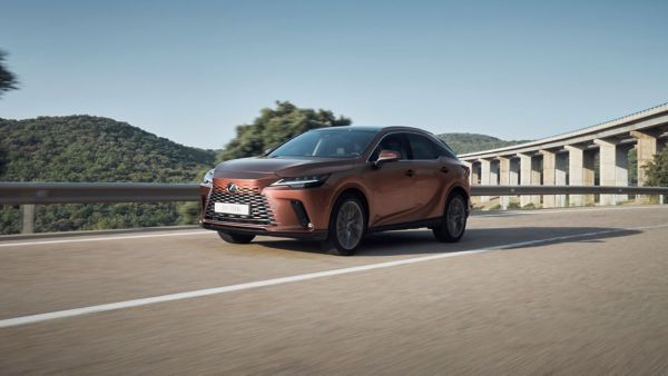 A Lexus RX driving on a country road