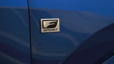 Lexus LX driving on a road 