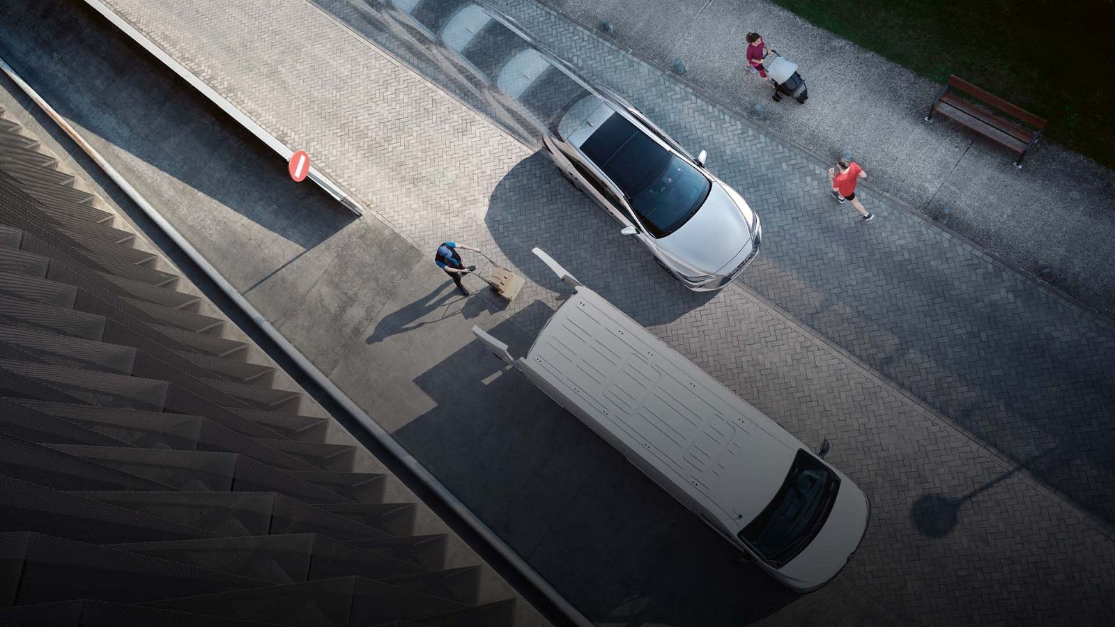 An aerial view of a Lexus RX navigating a busy street