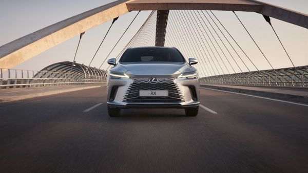 A Lexus RX driving over a bridge