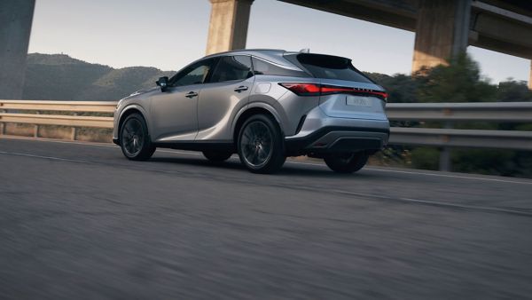 A Lexus RX driving on a road