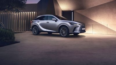 Lexus LX driving around a corner in a city location 