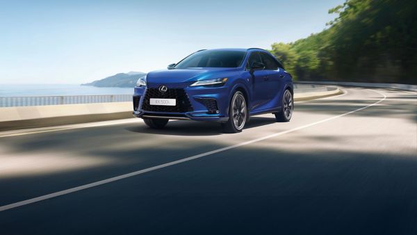 A Lexus RX driving on a coastal road