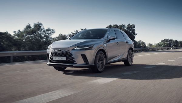 A Lexus RX driving on a country road