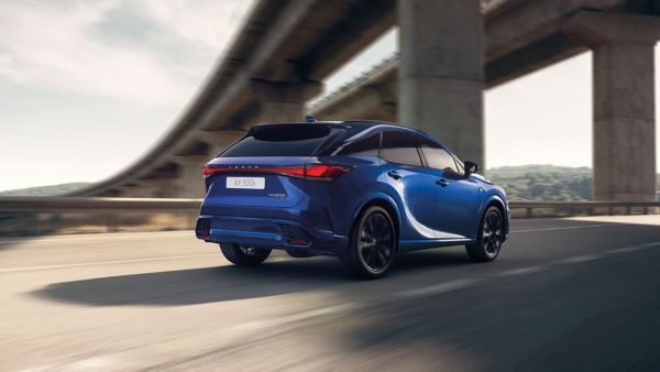 Rear view of a Lexus RX driving on city road