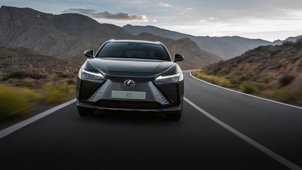 A Lexus RZ driving on a mountain road