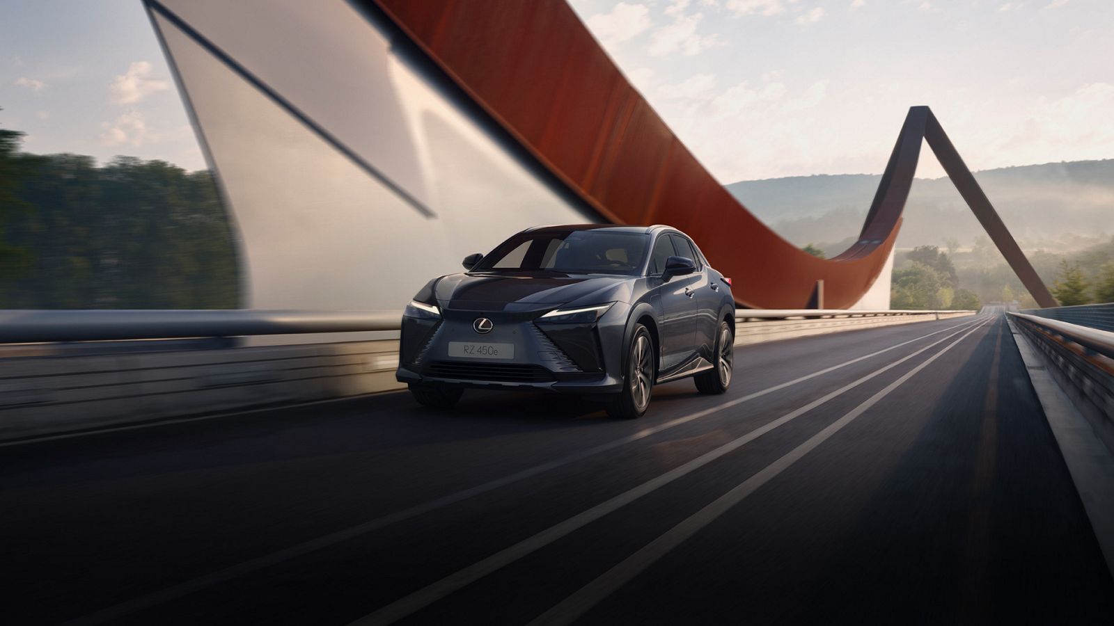 A Lexus RZ driving across a bridge